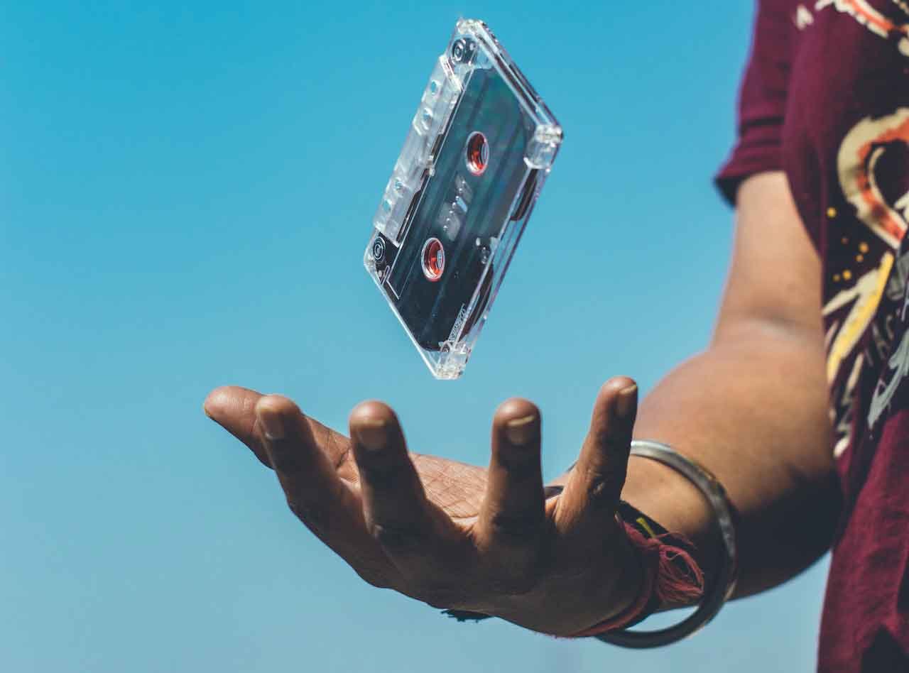 A person holding a cassette