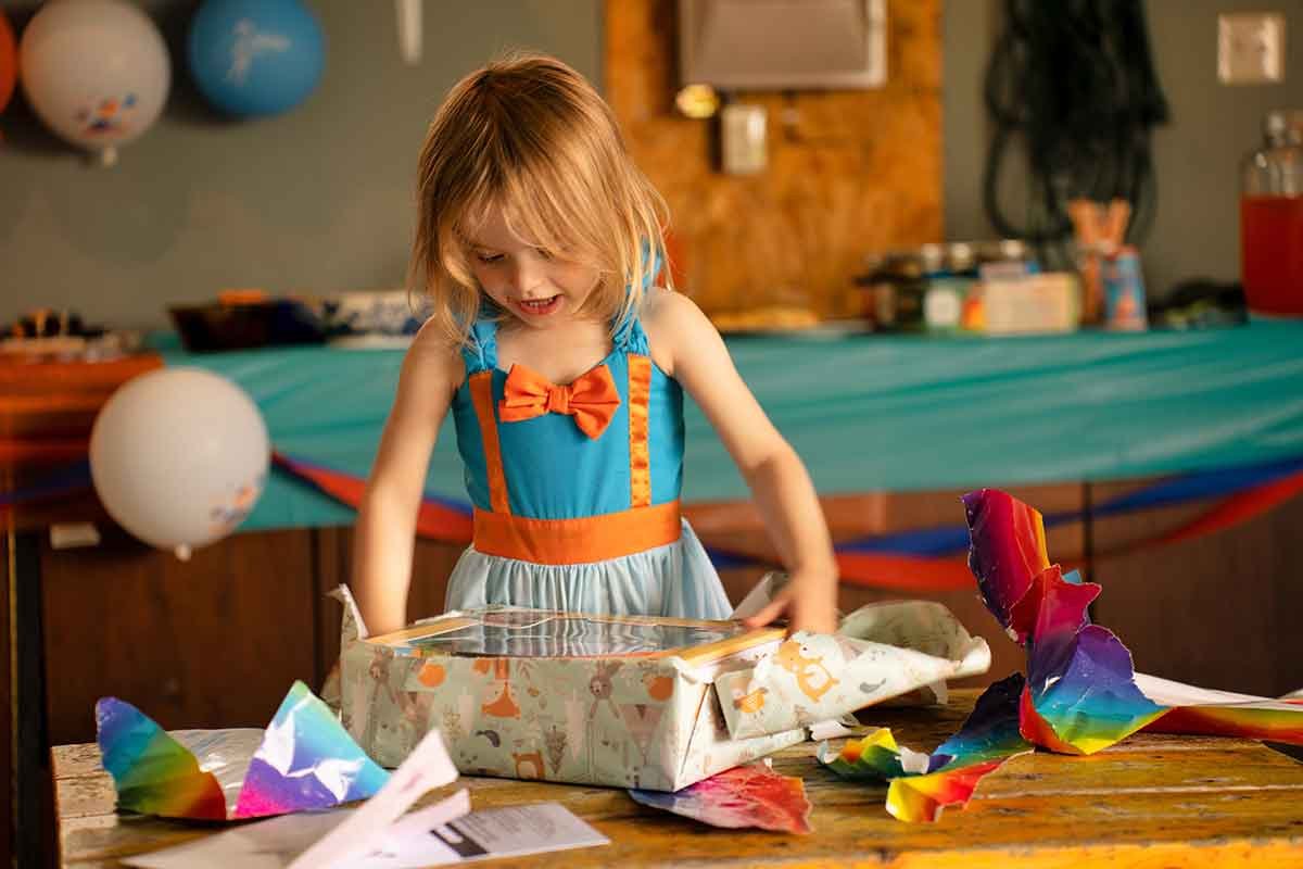 Girl opening a present.