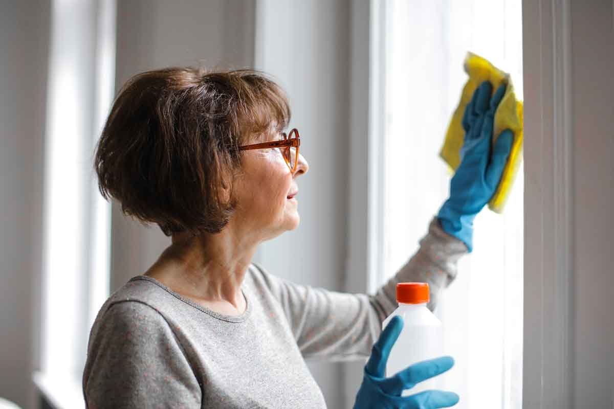 Woman cleaning a window